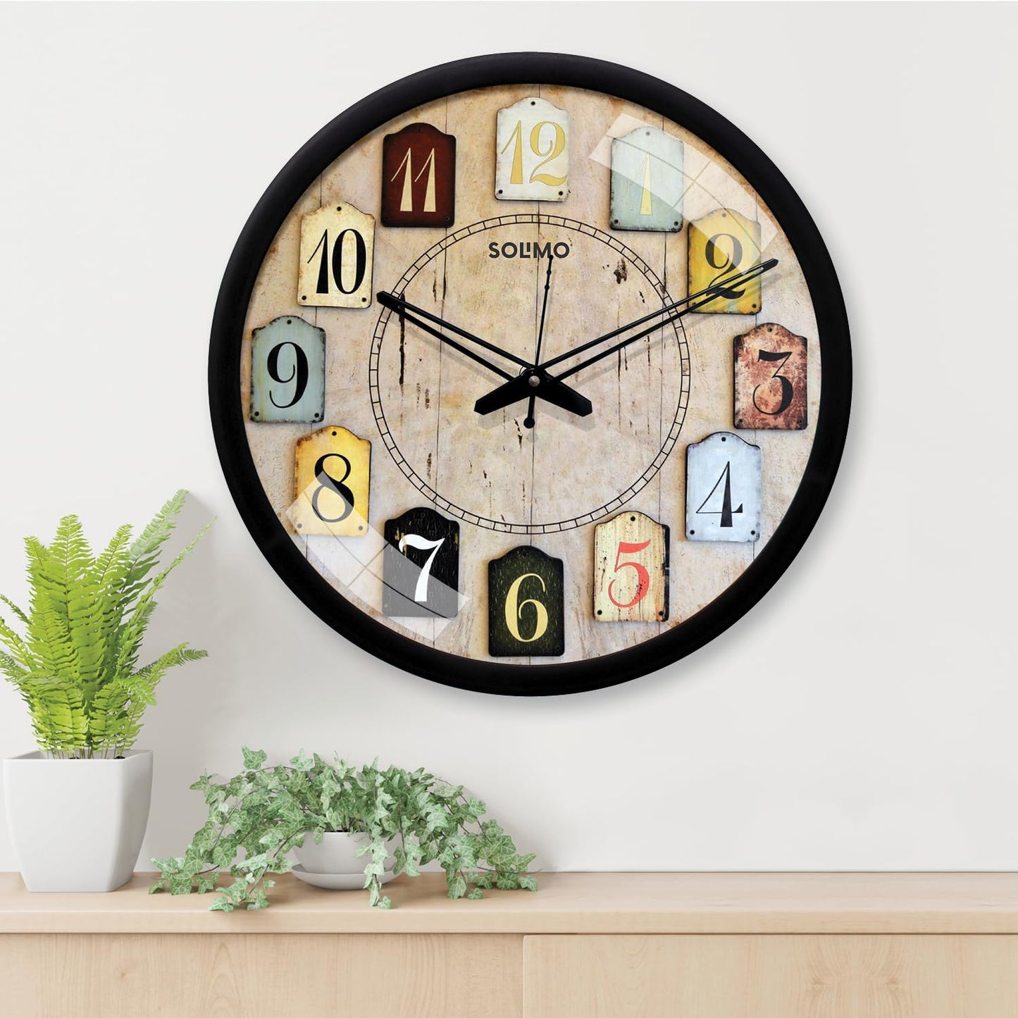 Amazon Brand - Solimo 12-Inch Contemporary Plastic&Glass Analog Wall Clock-Designer(Silent Movement,Black Frame)